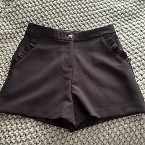 HAVE.. black dress pixie shorts with ruffles.